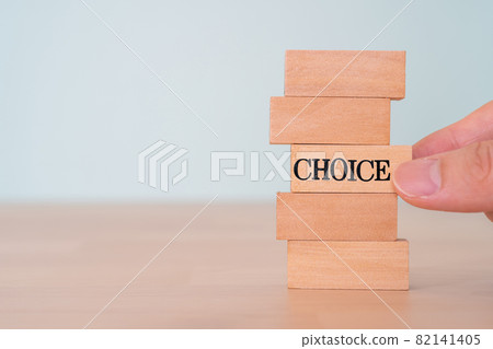 Choice | Building blocks with "CHOICE" written on them and the hands of the person holding them Choice | Building blocks with "CHOICE" written on them and the hands of the person holding them 82141405
