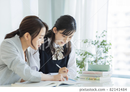 Female students receiving individual guidance at a cram school High school students Junior high school students Female students receiving individual guidance at a cram school High school students Junior high school students 82141484