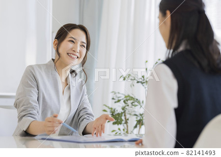 Cram school instructor interviewing female students High school students Junior high school students 82141493