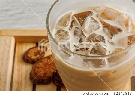 Ice cafe latte coffee in a transparent glass Ice cafe latte coffee in a transparent glass 82142818