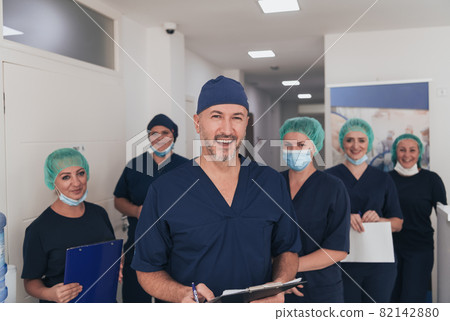 orthopedic doctor working together with his multiethnic team  orthopedic doctor working together with his multiethnic team  82142880