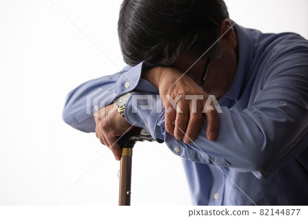 Senior man worried with a cane Senior man worried with a cane 82144877