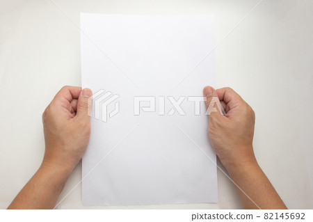 The concept of both hands that holding a white sheet a4 of paper blank 82145692