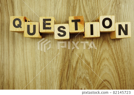 questions word in wooden cube alphabet letters top view on wooden background questions word in wooden cube alphabet letters top view on wooden background 82145723