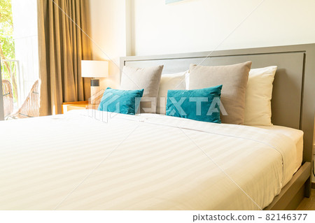 Decorative Pillows On Bed Arrangement With Bedroom Lamps And Bedside Tables  Stock Photo, Picture and Royalty Free Image. Image 103352867.