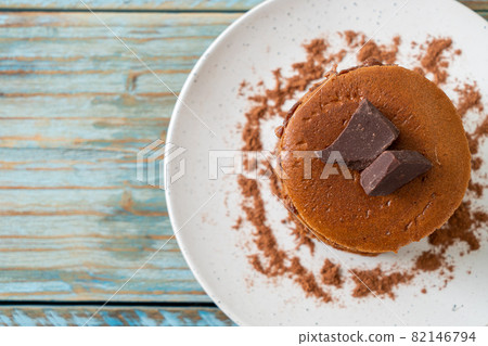 chocolate pancake stack on plate 82146794