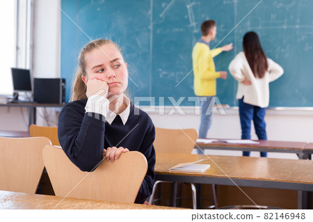 Portrait of thoughtful girl student in auditorium Portrait of thoughtful girl student in auditorium 82146948