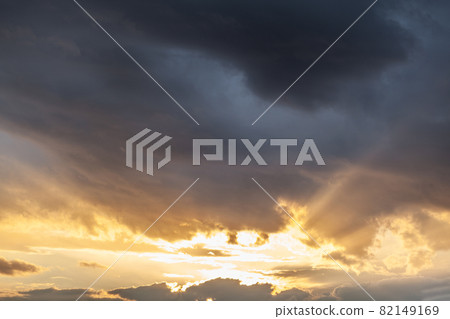 Colorful sunset or sunrise in the sky. The sun's rays are visible through the clouds. The sky and clouds are painted in different delicate colors. Beautiful background. Colorful sunset or sunrise in the sky. The sun's rays are visible through the clouds. The sky and clouds are painted in different delicate colors. Beautiful background. 82149169