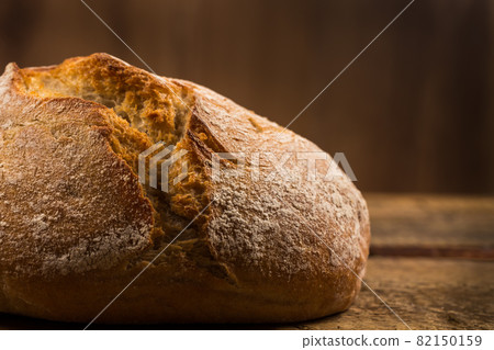white bread over wooden background 82150159
