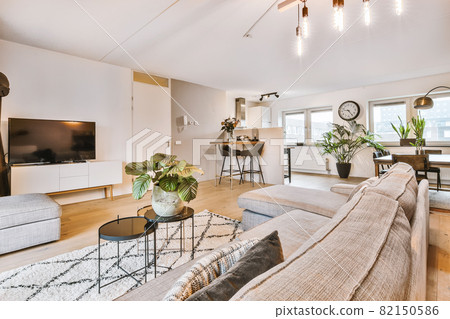 Elegant and spacious living room with beautiful furniture 82150586