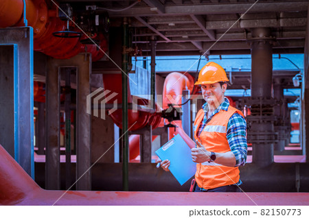 Industry engineer under checking the industry cooling tower air conditioner is water cooling tower air chiller HVAC of large industrial building to control air system. Industry engineer under checking the industry cooling tower air conditioner is water cooling tower air chiller HVAC of large industrial building to control air system. 82150773