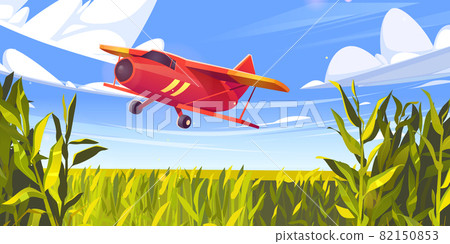 Crop duster plane flying over green corn field Crop duster plane flying over green corn field 82150853