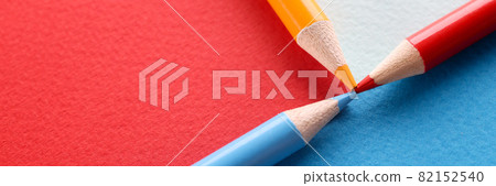 Colored pencils on multi-colored background connected with point together 82152540