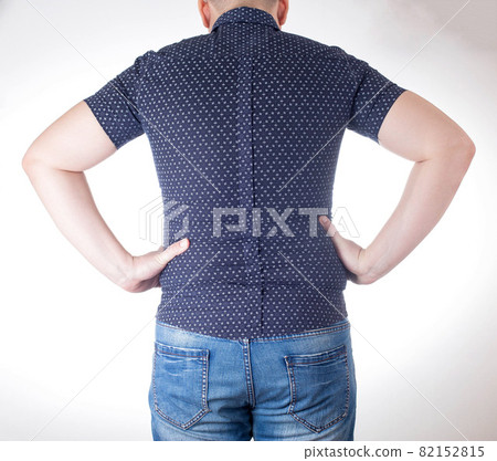 A man in a black tight shirt on a white background. Overweight, unhealthy diet and weight loss concept, close-up. Small clothing size A man in a black tight shirt on a white background. Overweight, unhealthy diet and weight loss concept, close-up. Small clothing size 82152815