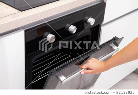 Modern oven with catalytic cleaning and grill built into the kitchen. Close-up 82152925