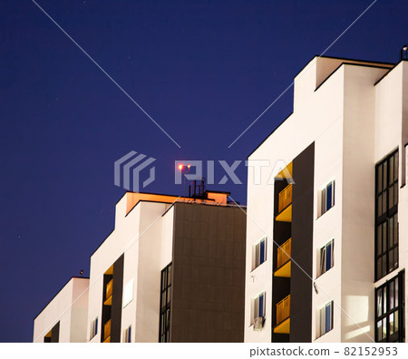 Night obstruction red LED light on a high-rise building. Security and dimensions of the building for aircraft, copy space for text 82152953