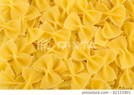 Bow tie pasta background. Top view. Flat lay. 82153901