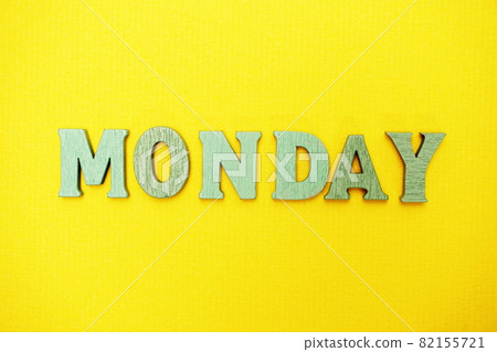 Monday word alphabet letters on yellow background Monday word alphabet letters on yellow background 82155721