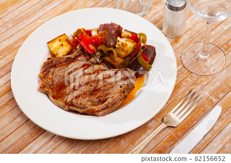 Grilled veal entrecote with side dish of sauteed vegetables Grilled veal entrecote with side dish of sauteed vegetables 82156652