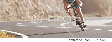 Road bike cyclist man cycling, athlete on a race cycle 82156850