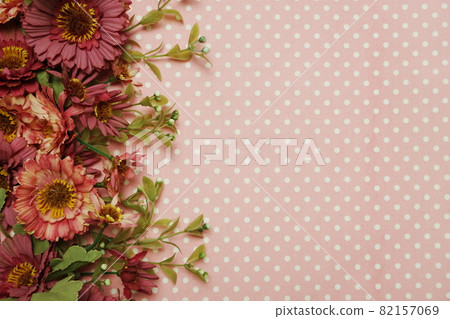 Flower border with pink polka dot background Flower border with pink polka dot background 82157069