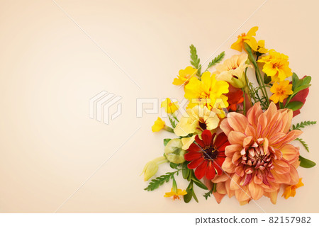 Delicate blossoming dahlias and orange flowers, blooming festive fall frame background, autumn bouquet floral card, selective focus, toned Delicate blossoming dahlias and orange flowers, blooming festive fall frame background, autumn bouquet floral card, selective focus, toned 82157982