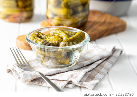 Small pickles. Marinated pickled cucumbers in bowl. Small pickles. Marinated pickled cucumbers in bowl. 82158786