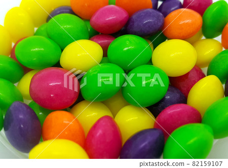 Bright candies in multicolored glaze, close up background Bright candies in multicolored glaze, close up background 82159107