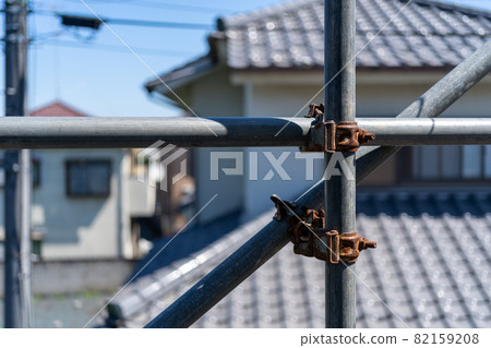 Steel frame of scaffolding of a building whose exterior wall is being painted Steel frame of scaffolding of a building whose exterior wall is being painted 82159208