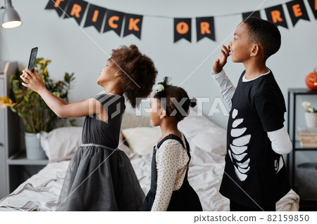 Kids Taking Selfie on Halloween Kids Taking Selfie on Halloween 82159850