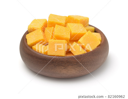 Wooden bowl of candied mango dice Wooden bowl of candied mango dice 82160962