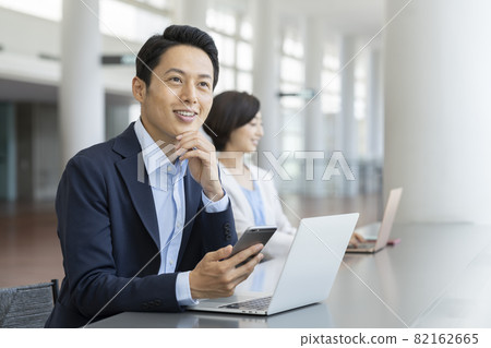 Business image Shared office Business person working in a coworking space 82162665
