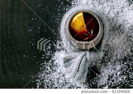 Hot mulled wine with spices and Christmas decorations Hot mulled wine with spices and Christmas decorations 82164088