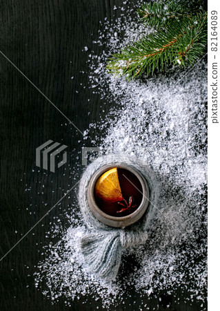 Hot mulled wine with spices and Christmas decorations Hot mulled wine with spices and Christmas decorations 82164089