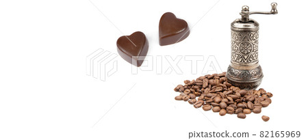 Manual coffee grinder for grinding coffee beans solated on white background. Free space for text. Wide photo. 82165969
