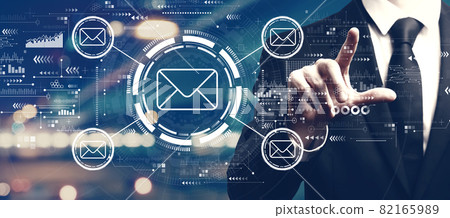 Email concept with a man on city background Email concept with a man on city background 82165989