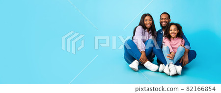 African American family posing sitting on the floor African American family posing sitting on the floor 82166854