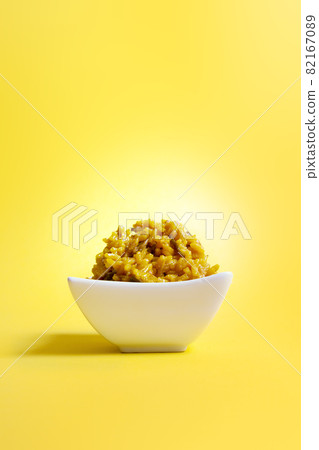 isolated  bowl with rice color yellow 82167089