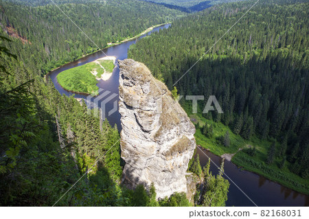 The picturesque Devil's Finger rock overlooking the Usva River. Massif Usvinskie Pillars. Perm Territory. Russia 82168031