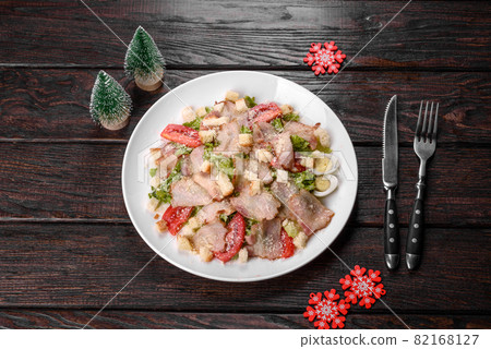Tasty fresh salad prepared for the Christmas table 82168127