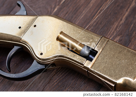 Old west gun - lever-action repeating rifle with bullet Old west gun - lever-action repeating rifle with bullet 82168142