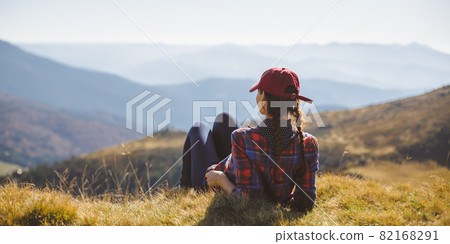 Female Hiker Resting on Top of the Mountain 82168291
