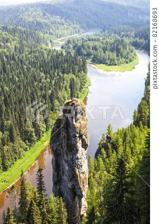The picturesque Devil's Finger rock and the Usva river. View from above. Massif Usvinskie Pillars. Perm Territory. Russia 82168693