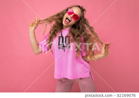 Photo shot of beautiful happy positive young dark blonde woman wearing casual clothes and stylish Photo shot of beautiful happy positive young dark blonde woman wearing casual clothes and stylish 82169076