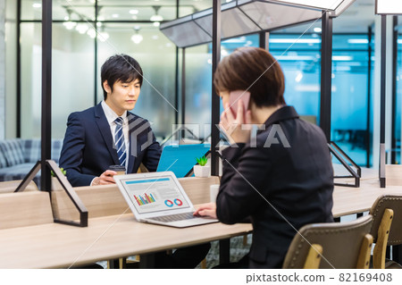 Business person working in a shared office Business person working in a shared office 82169408