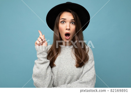 Photo of young positive amazed attractive pretty brunette woman with sincere emotions wearing casual Photo of young positive amazed attractive pretty brunette woman with sincere emotions wearing casual 82169891