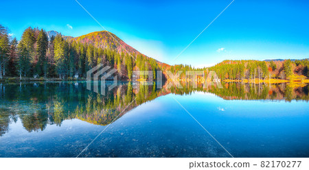 Fairytale  view of Fusine lake with Mangart peak on background 82170277