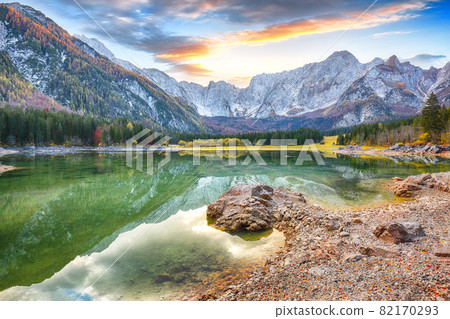 Fantastic view of Fusine lake with Mangart peak on background Fantastic view of Fusine lake with Mangart peak on background 82170293