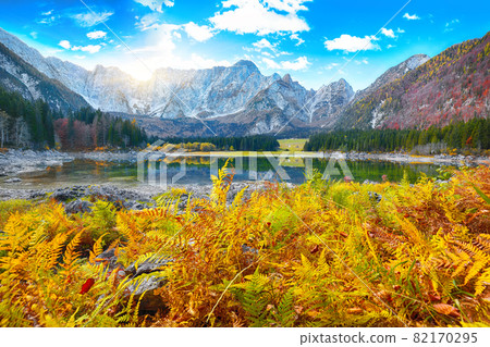 Fairytale  view of Fusine lake with Mangart peak on background 82170295