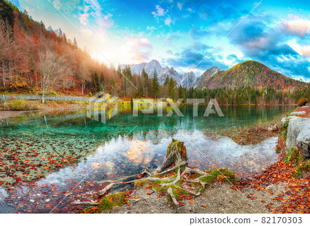 Breathtaking view of sunset over Fusine lake with Mangart peak on background. 82170303